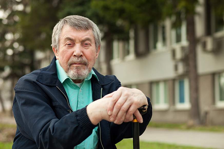 close-up portrait of an old man on a walk in the park