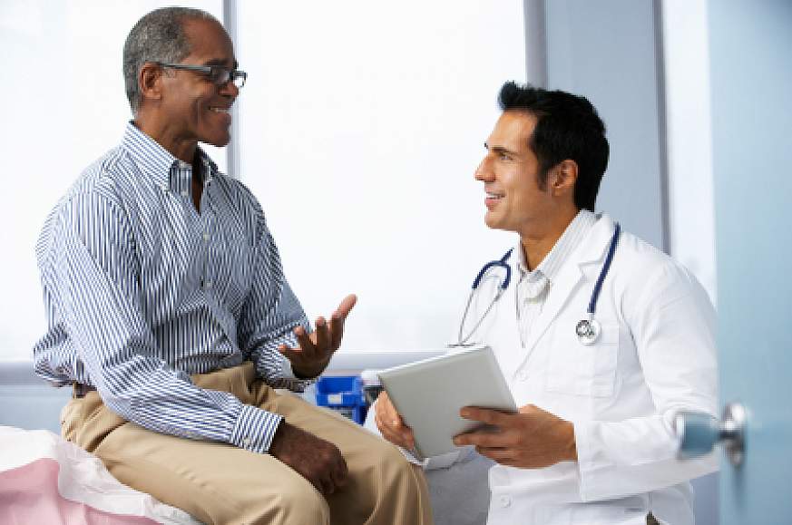A man talking with his doctor