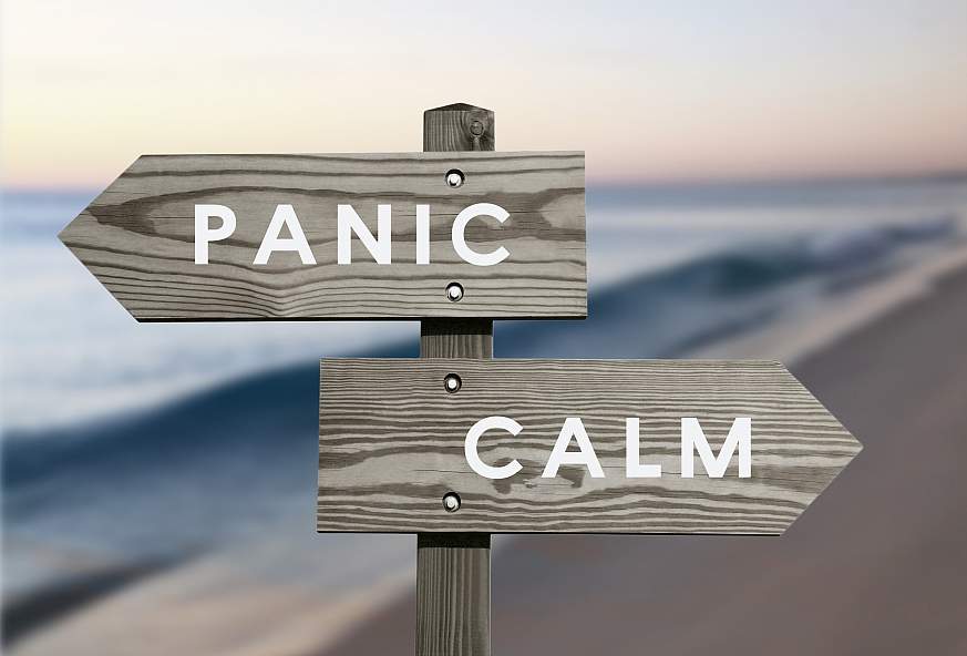Panic and calm signs pointing in different directions