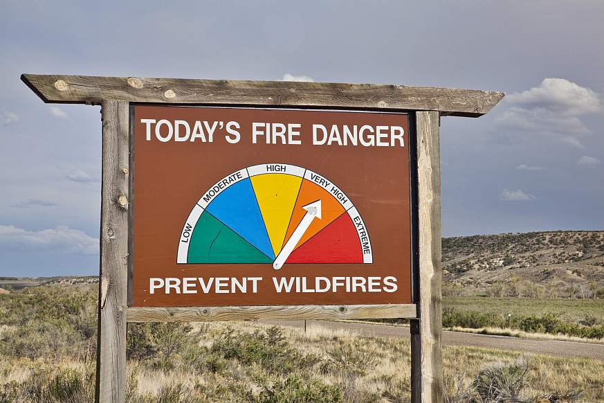 Fire danger roadside sign with arrow pointed to very high