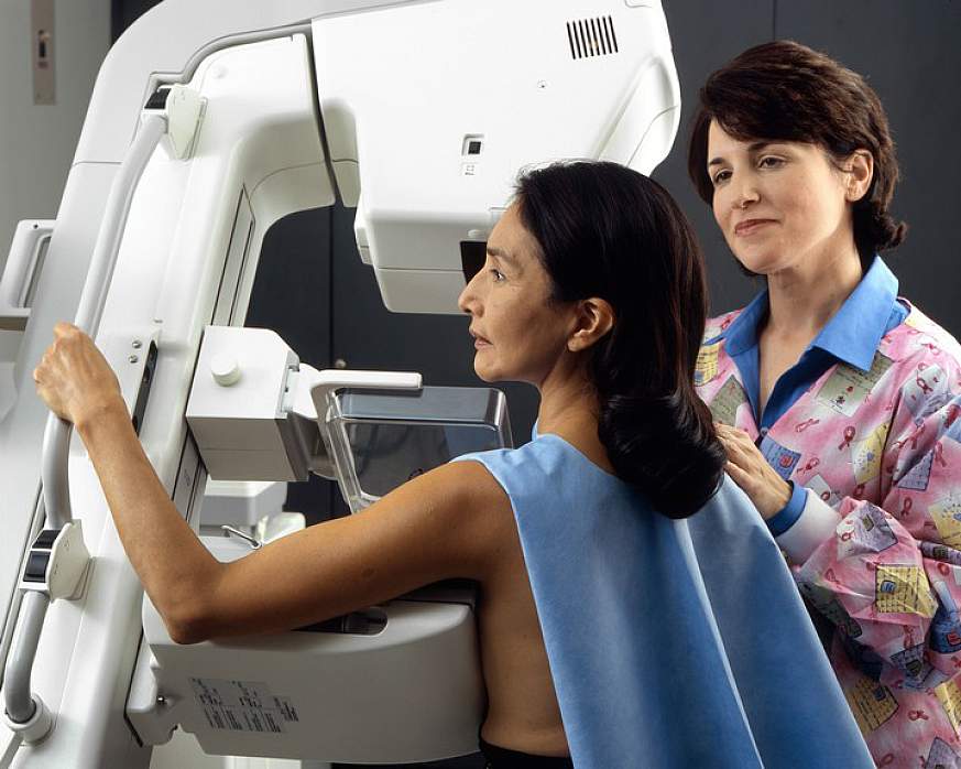 Woman receiving a mammography.