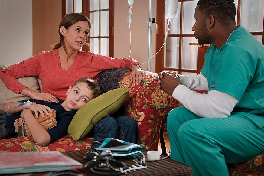 A mother and son with a healthcare worker