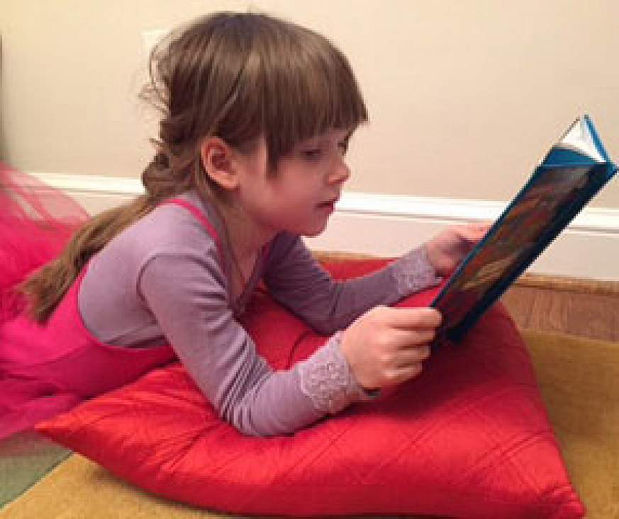 Child reading a book