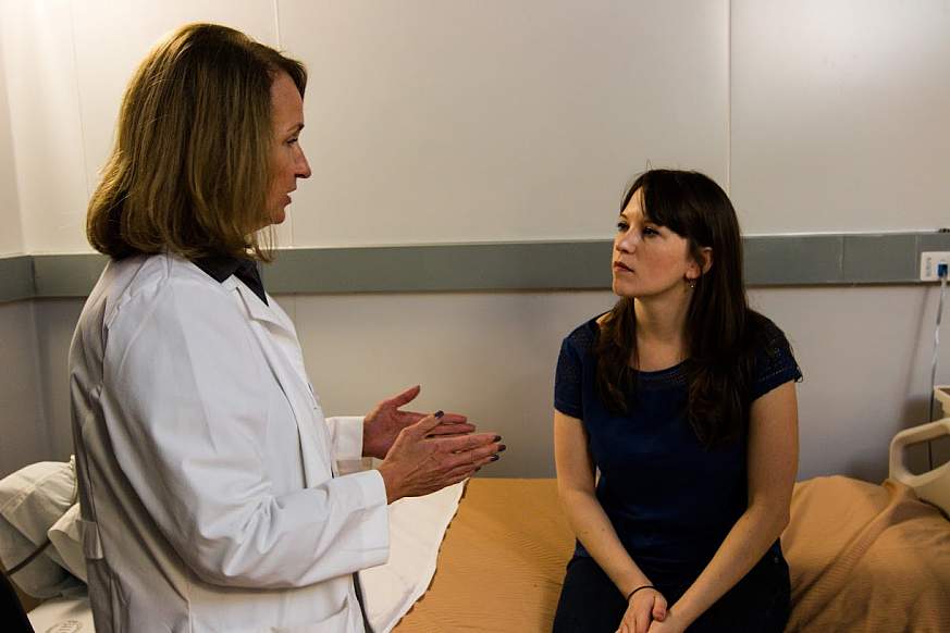 A doctor speaks with a patient