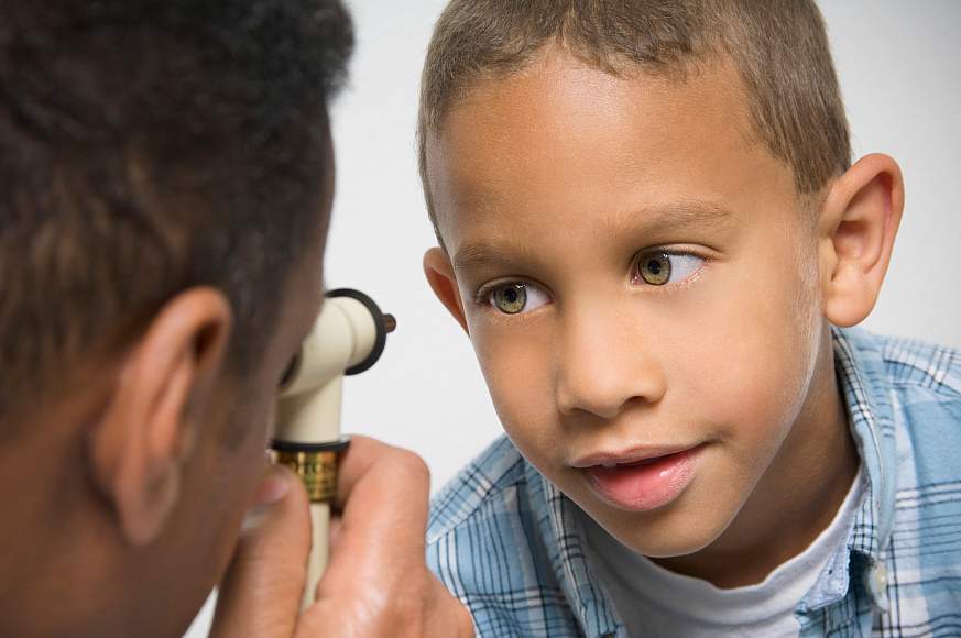 Image of a child receiving an eye exam