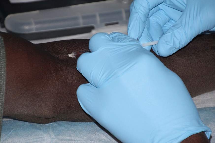 Image of a volunteer receiving a vaccine