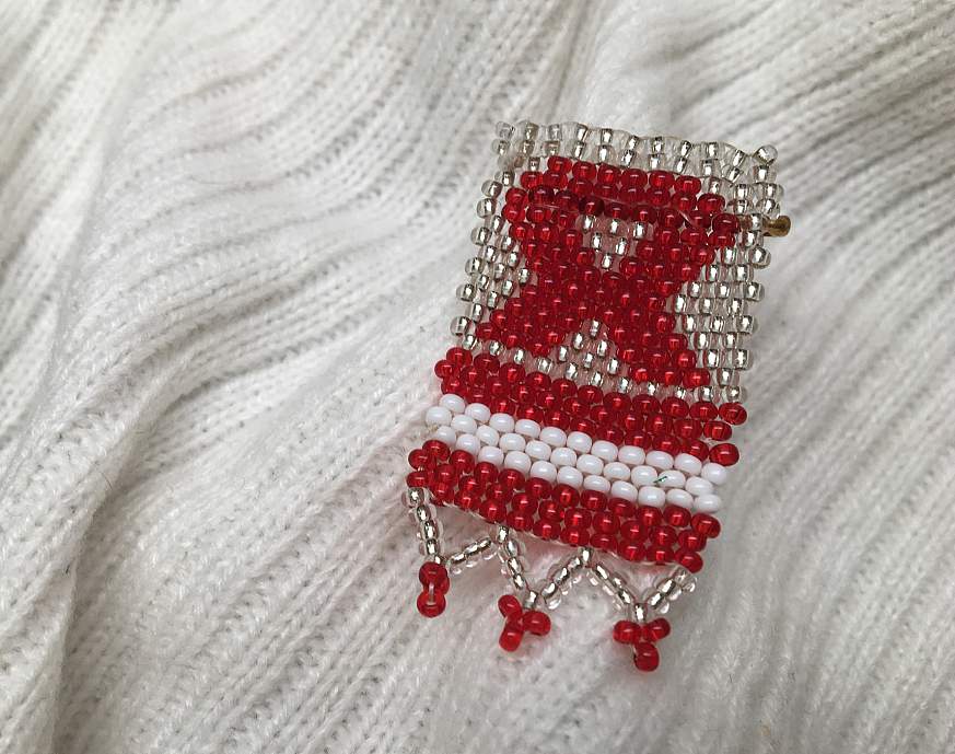 HIV/AIDS Awareness ribbon pin. 
