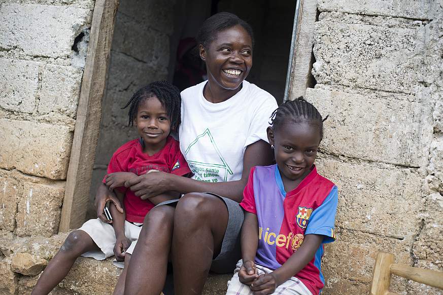 Image of a health worker with children