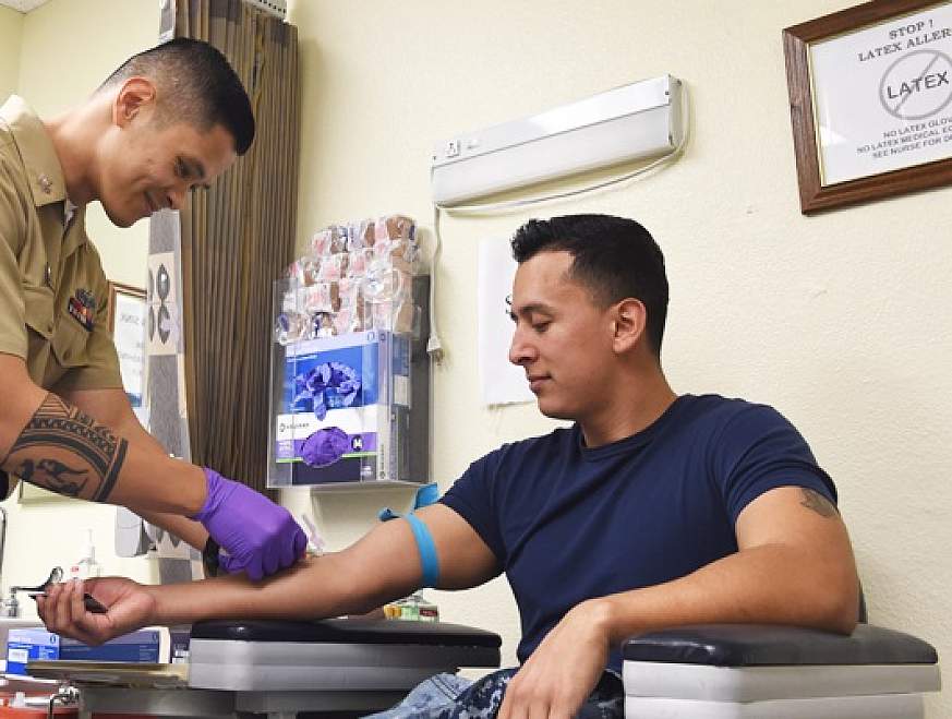 Patient receiving blood draw.