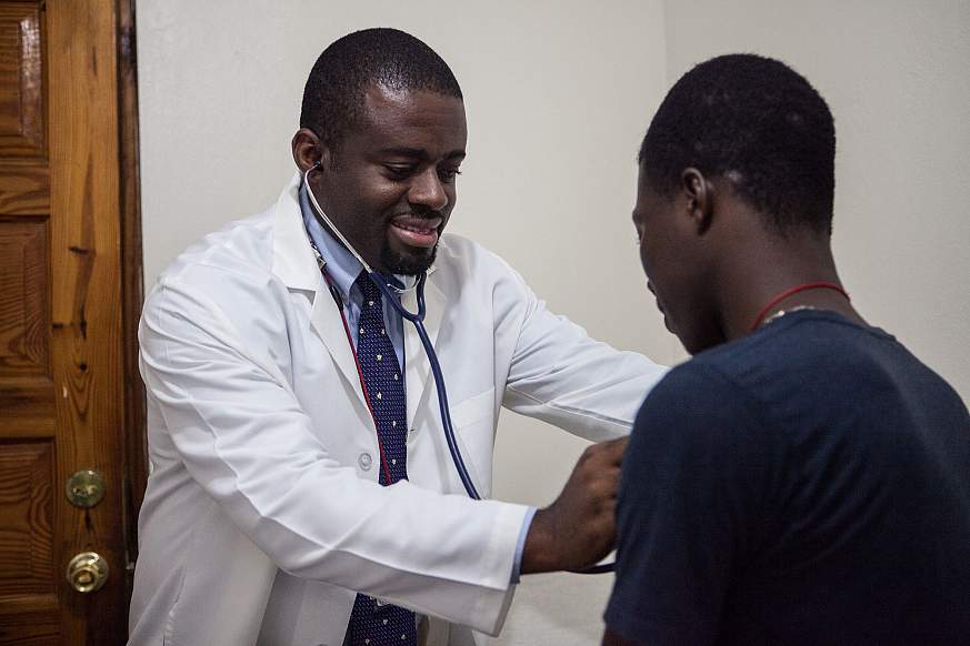 Image of a doctor examining a patient.