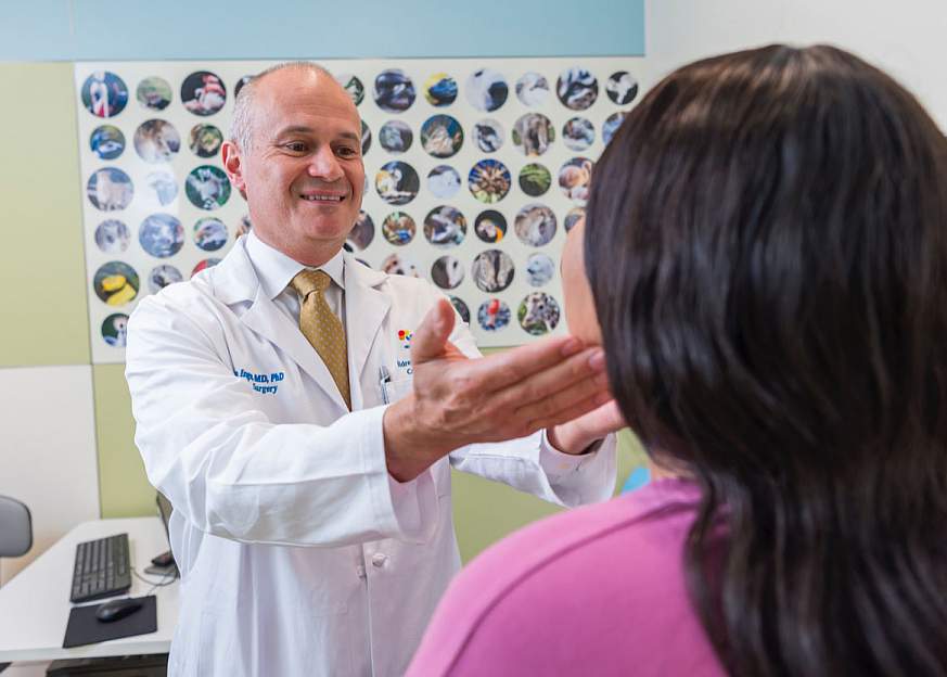 Dr. Thomas Inge examines a patient. 