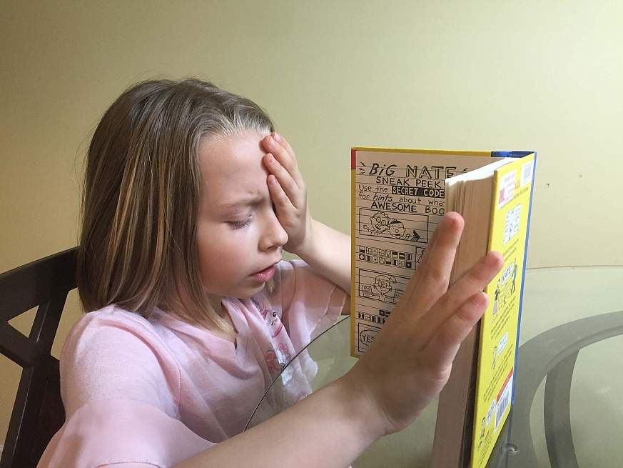 Image of a child reading 