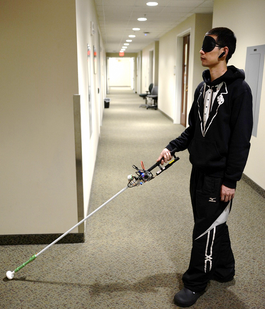 Person tests robotic cane