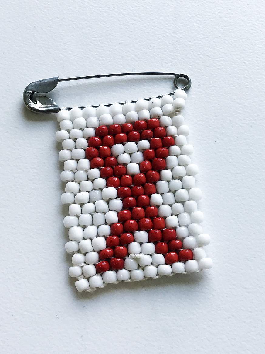 An AIDS awareness pin.