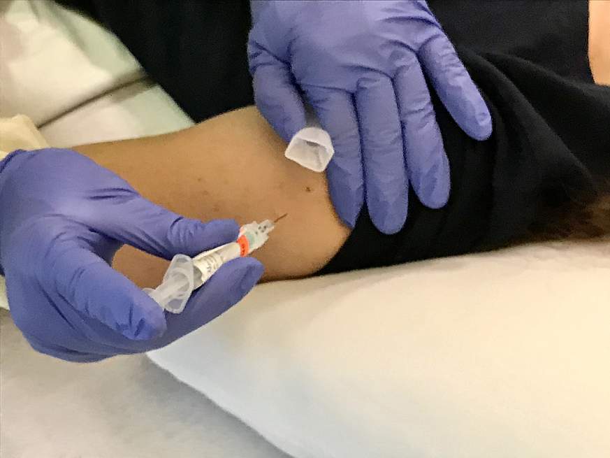 Image of a person getting a shot