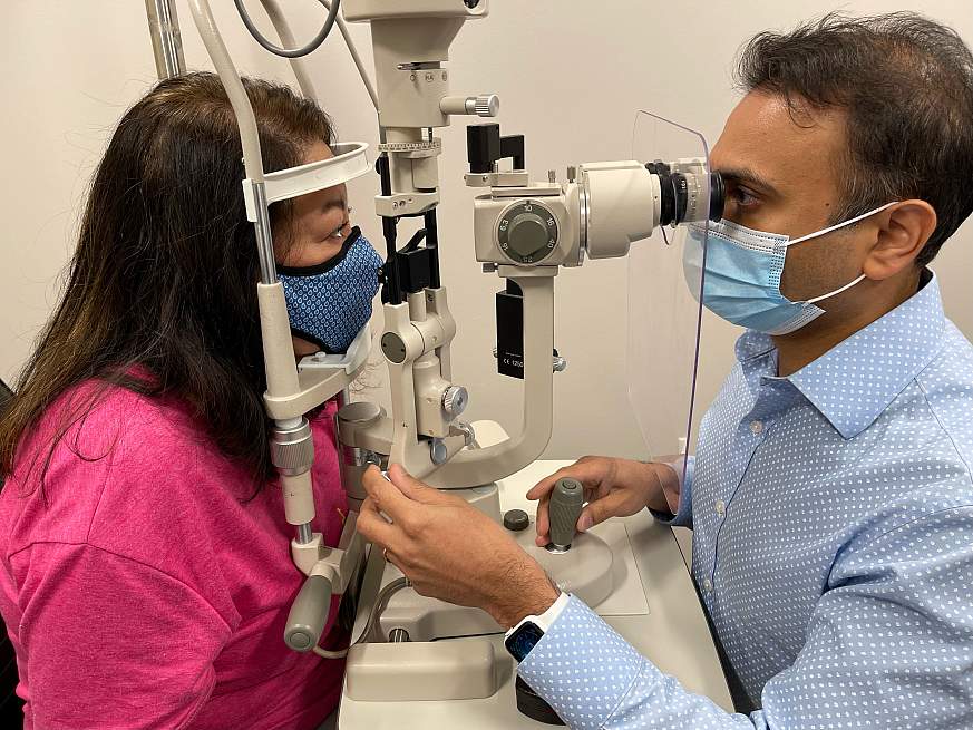 Image of a doctor performing an eye exam