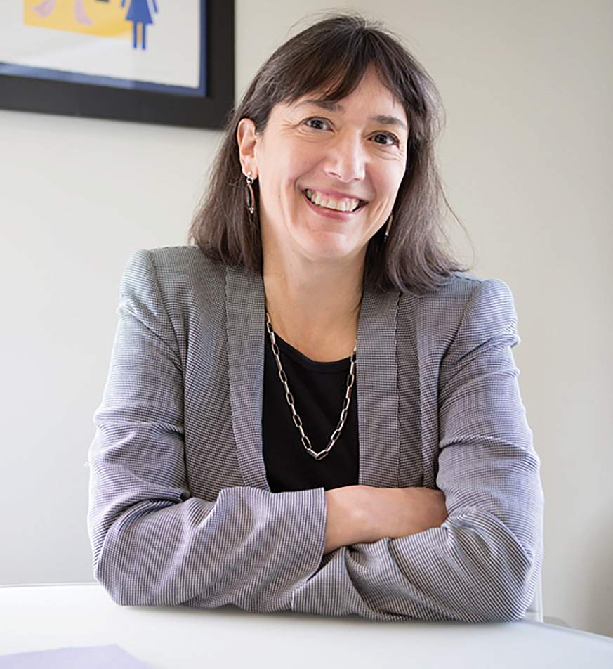 Dr. Monica Bertagnolli pictured smiling and seated in an office