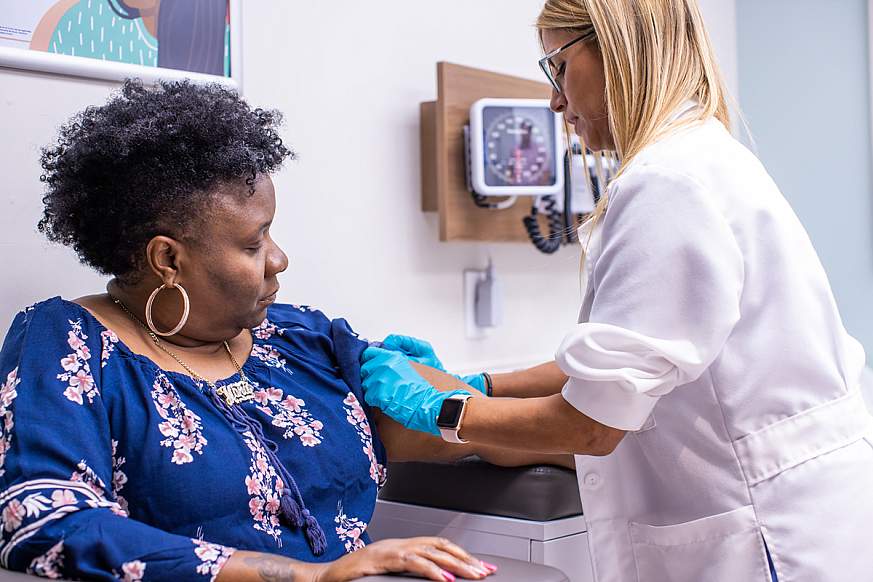 Image of a researcher collecting a blood sample