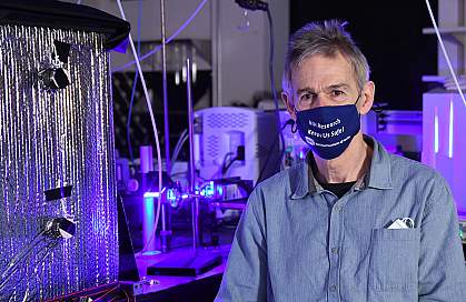 Researcher sits in his lab