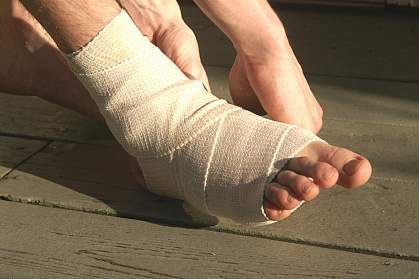 Foot and ankle wrapped with an elastic bandage