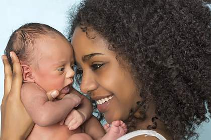 Photo of a newborn baby and mother