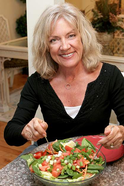 Older woman eating a salad
