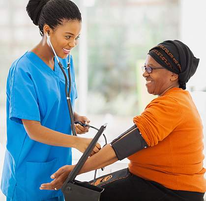 a photo of a woman having her blood pressure taken