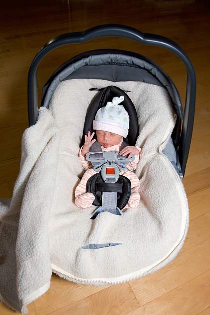Photo of a premature infant in a carseat