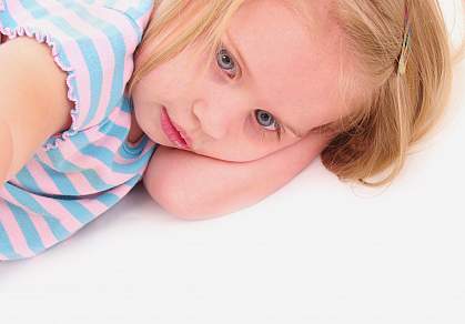 Photo of a young girl staring away from the camera