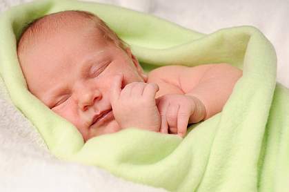 Photo of newborn baby sleeping peacefully