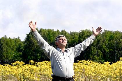 Photo of a man standing in a field