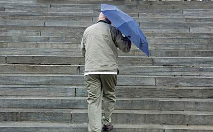 Photo of a man climbing stairs