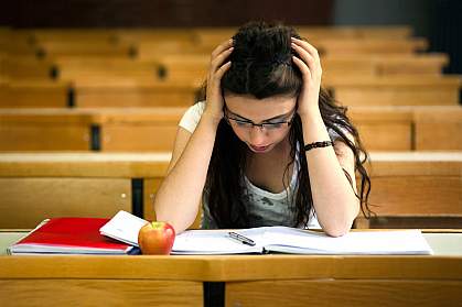 Photo of a young woman studying