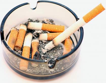 Photo of ashtray filled with cigarette stubs