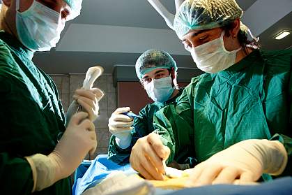 Photo of surgeons at work in the operating room