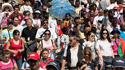 Multi-ethnic crowd outdoors.