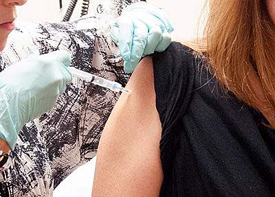 Person receiving a vaccine