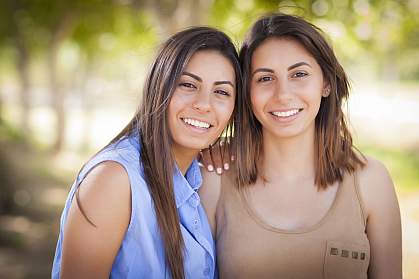 Portrait of mixed race twin sisters.