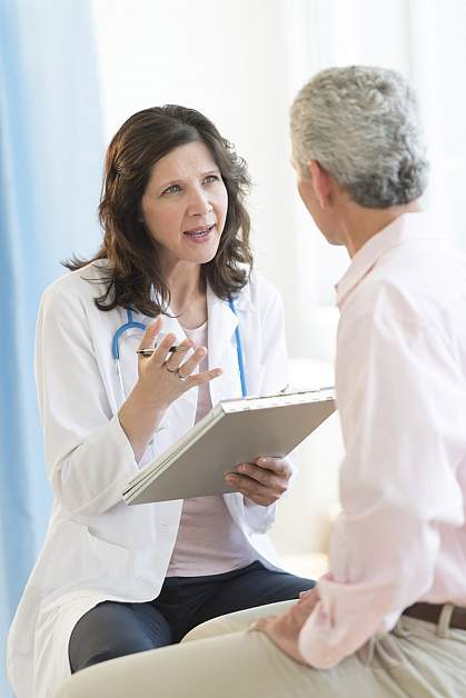 Man talking to doctor.