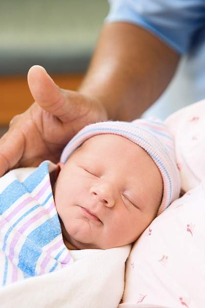 Newborn wrapped in blanket.