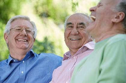 Three senior men laughing