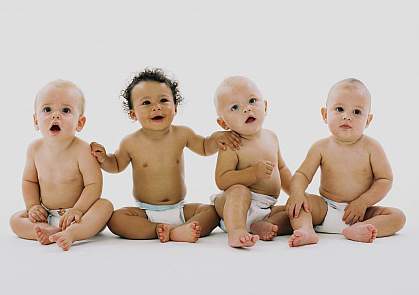 Group of infants sitting in their diapers
