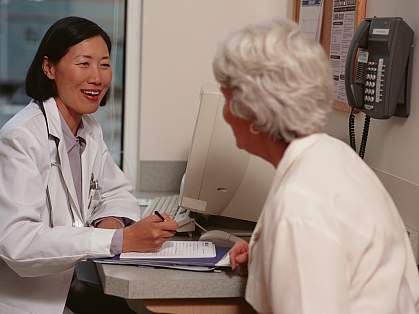 Senior woman speaking with a doctor.