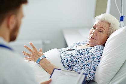 Older woman in hospital bed