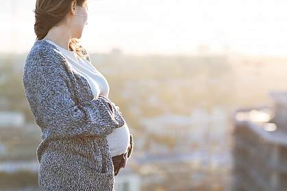 Happy pregnant woman outdoors