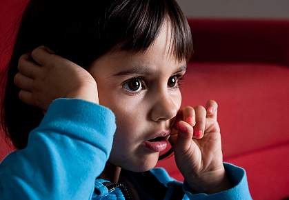 Young girl reacting with emotion to something she sees