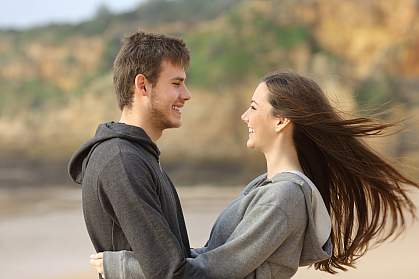 Happy teen couple gazing into each other’s eyes.