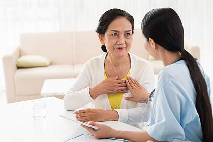 Older woman and doctor discussing heart diseases