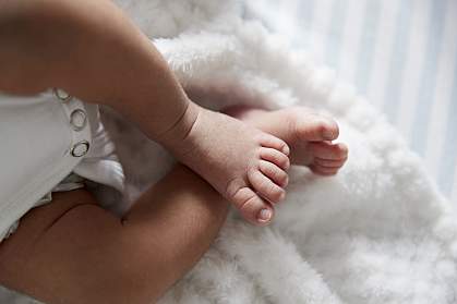 Feet of infant girl.