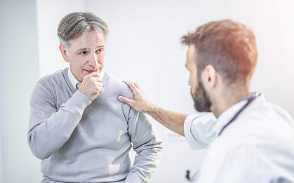 Man talking to doctor